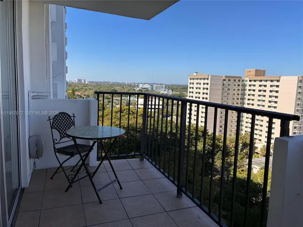 a view of a balcony with chairs