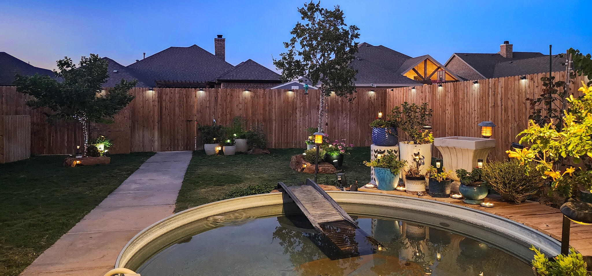 7808 58th Street Lubbock, TX 79407 - Photo 3 of 50 a view of a house with backyard and sitting area