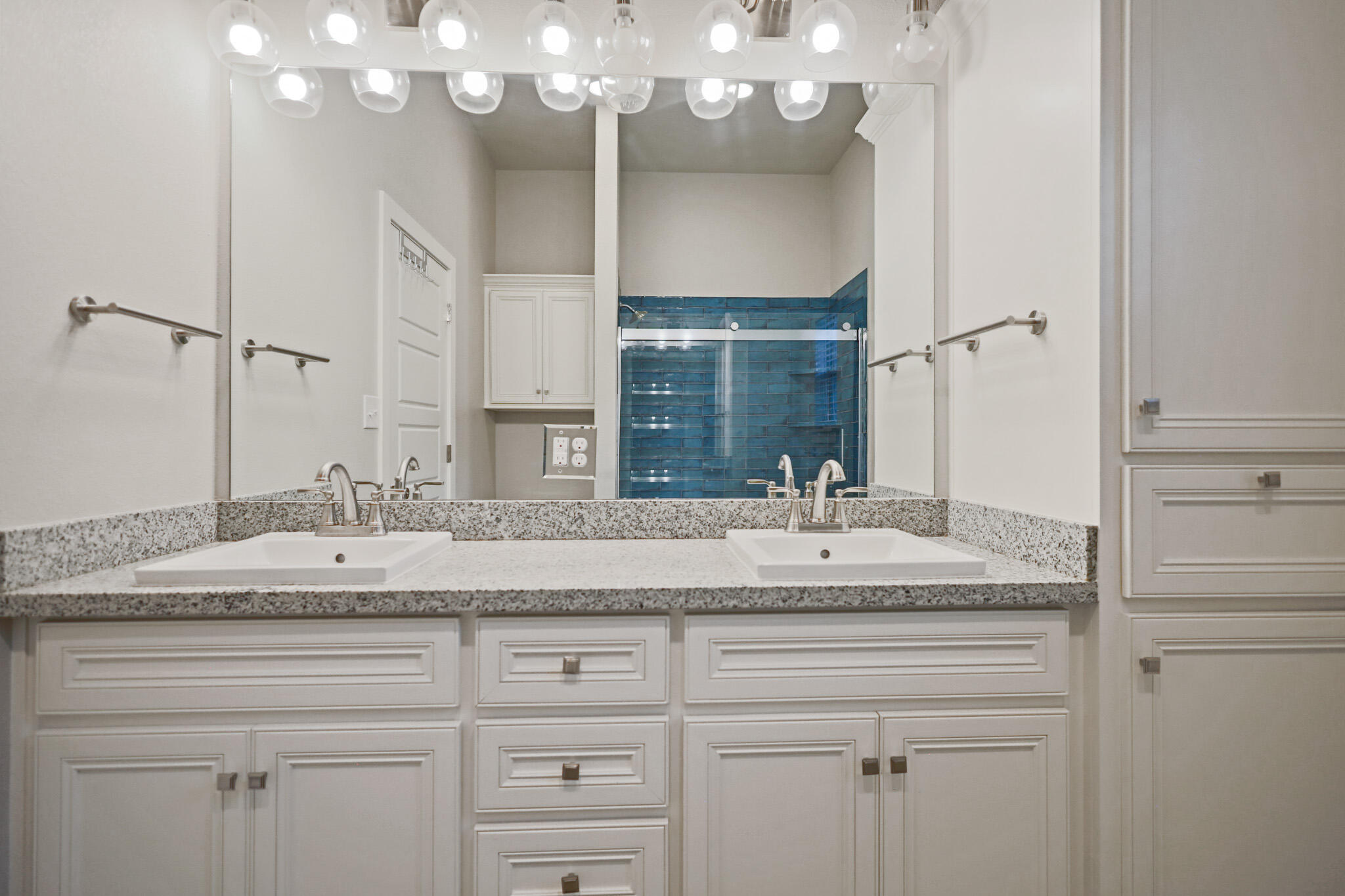7808 58th Street Lubbock, TX 79407 - Photo 38 of 50 a bathroom with a sink vanity granite and a mirror