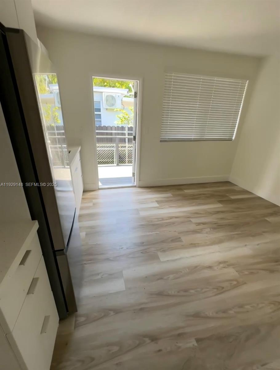 111 Southwest 31st Court, Unit 4 Miami, FL 33135 - Photo 3 of 6 a view of an empty room with a window