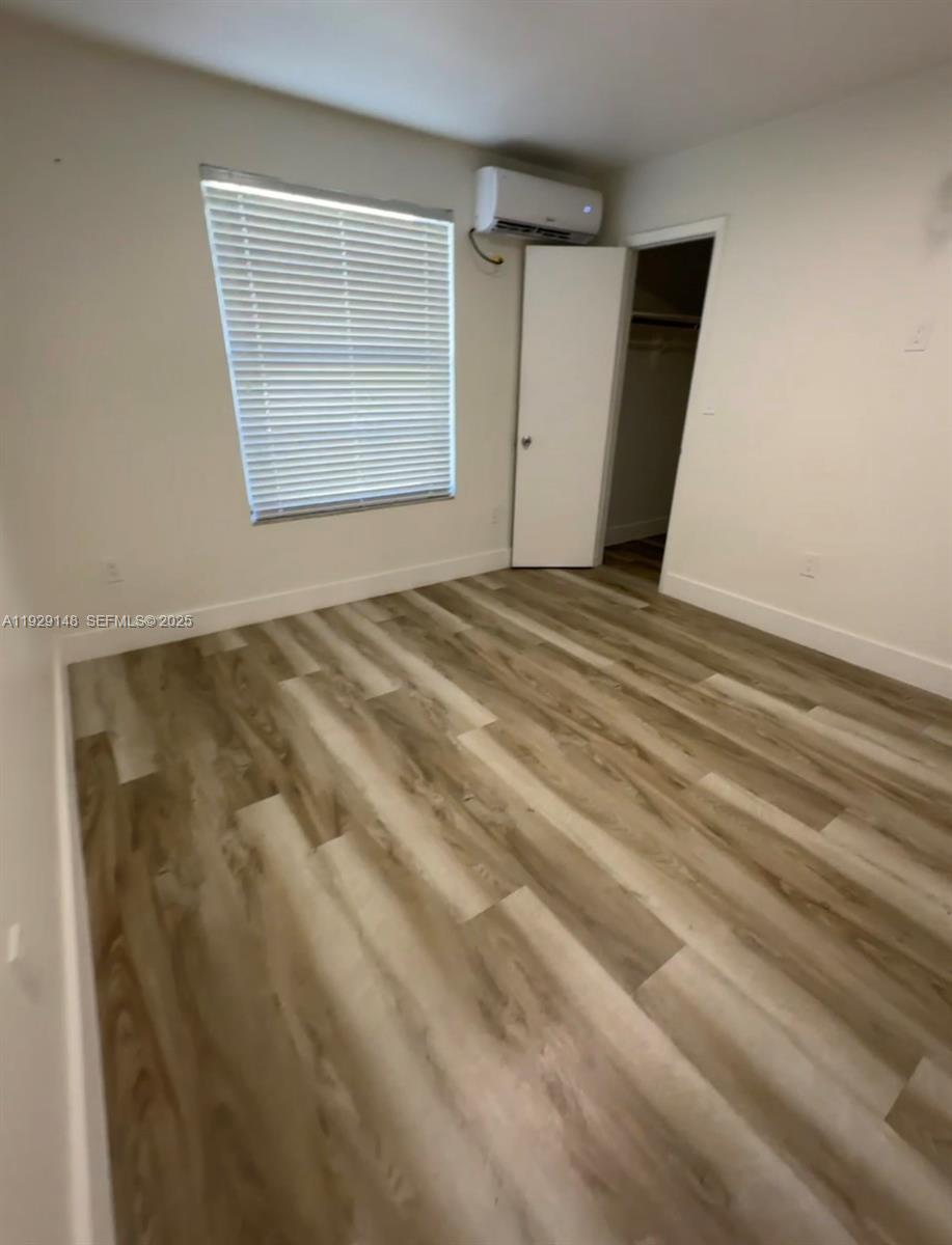 111 Southwest 31st Court, Unit 4 Miami, FL 33135 - Photo 5 of 6 a view of an empty room with closet and window
