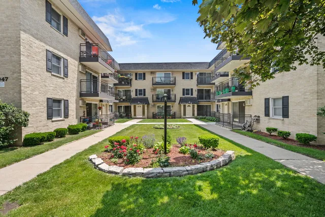 a view of a swimming pool with a garden