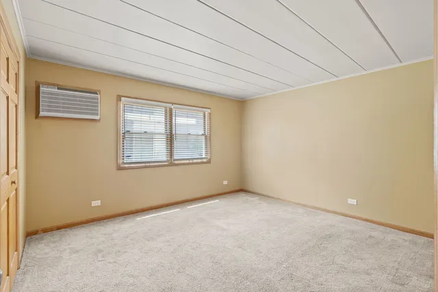 a view of an empty room with windows