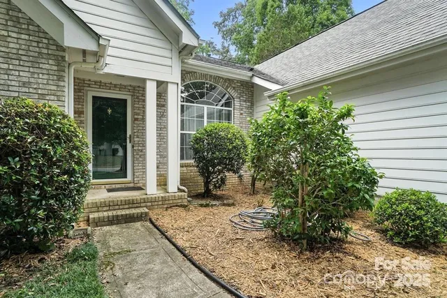 a view of house with backyard
