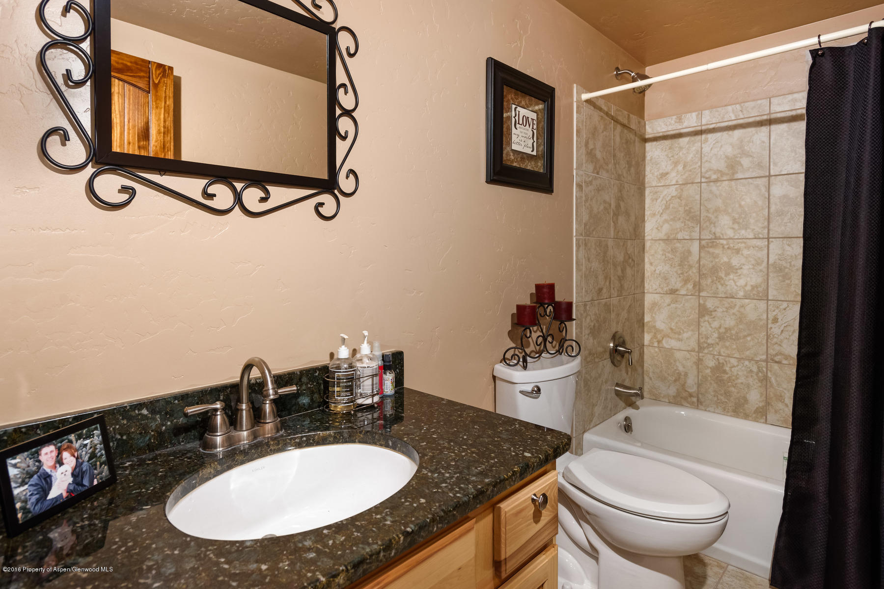 1327 Clover Court Rifle, CO 81650 - Photo 12 of 21 a bathroom with a granite countertop sink toilet and a mirror