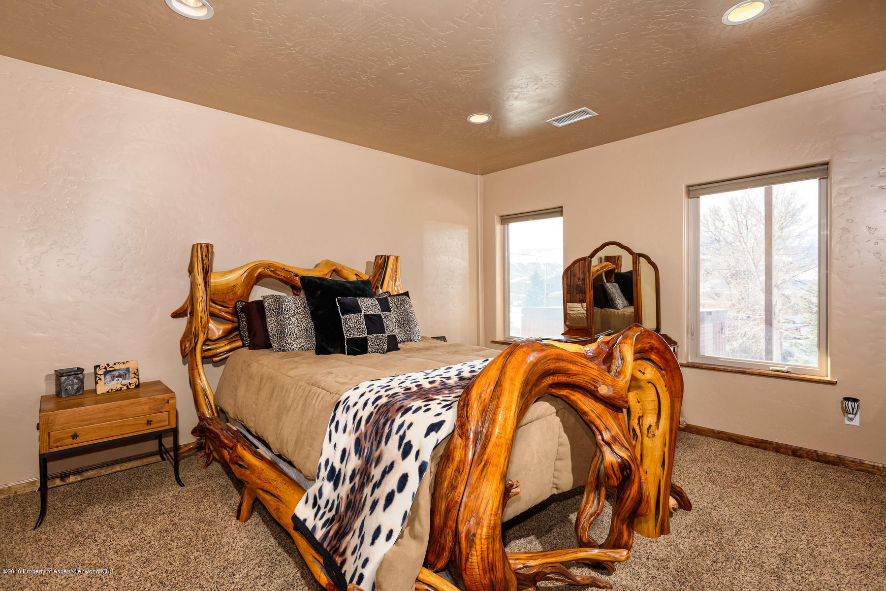 1327 Clover Court Rifle, CO 81650 - Photo 16 of 21 a bedroom with a bed and window