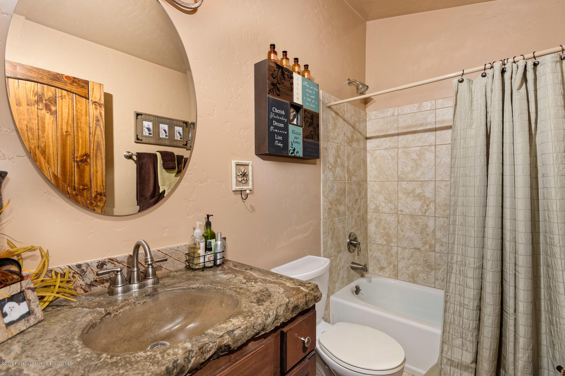 1327 Clover Court Rifle, CO 81650 - Photo 17 of 21 a bathroom with a granite countertop sink toilet and shower