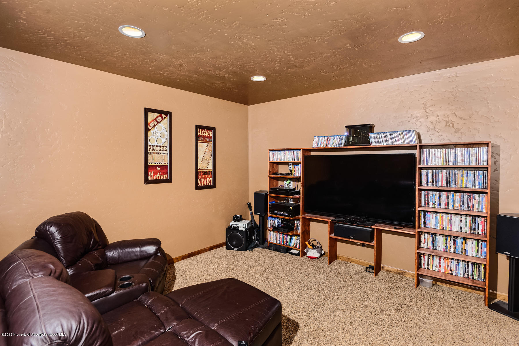 1327 Clover Court Rifle, CO 81650 - Photo 19 of 21 a living room with furniture and a flat screen tv