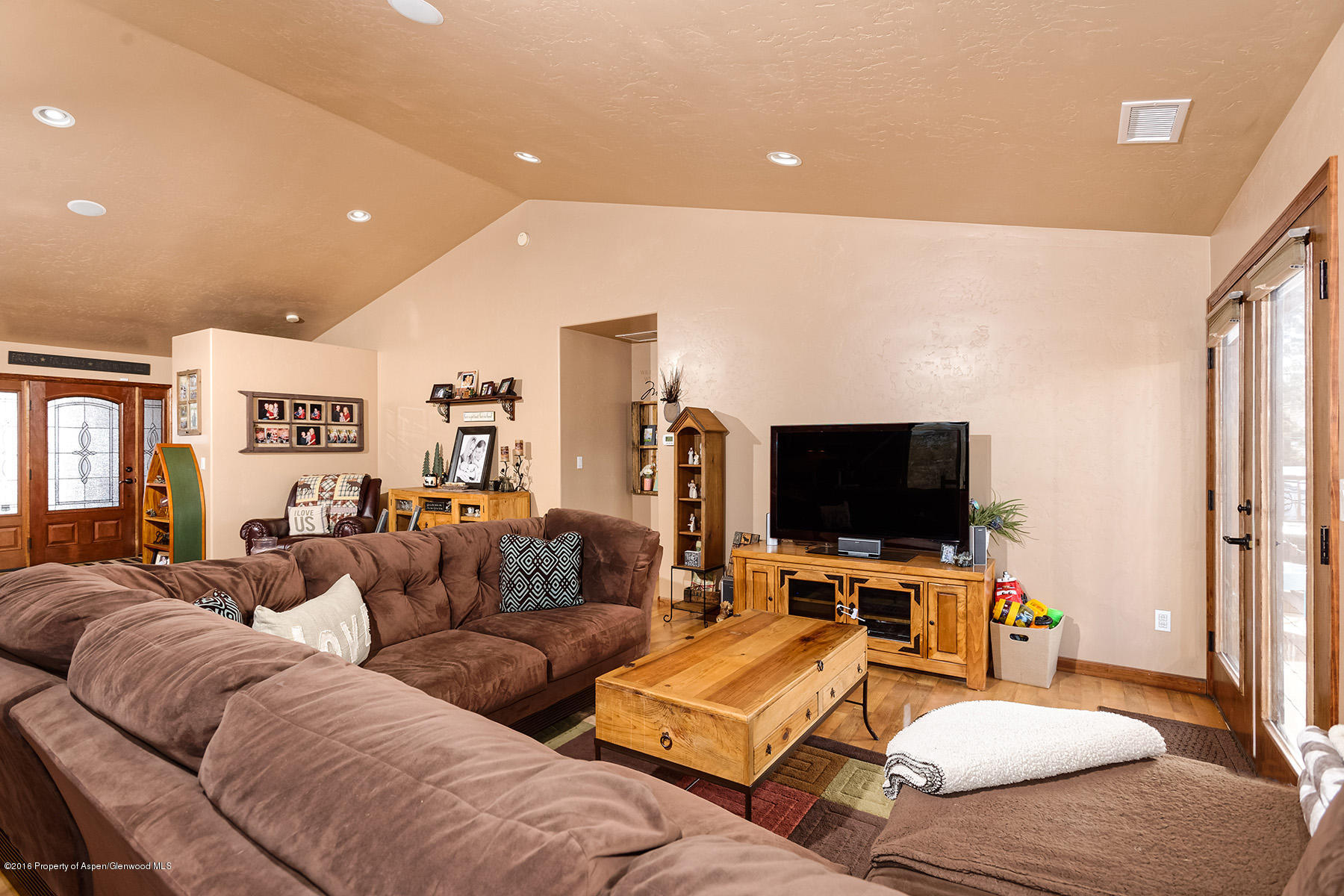 1327 Clover Court Rifle, CO 81650 - Photo 6 of 21 a living room with furniture and a flat screen tv