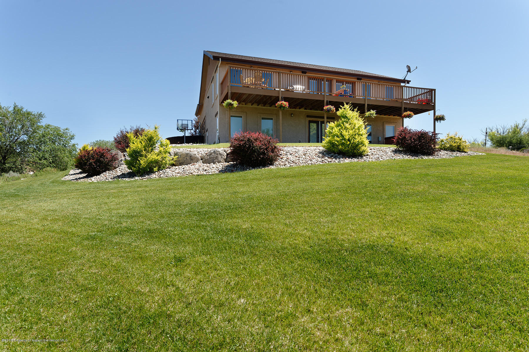 1327 Clover Court Rifle, CO 81650 - Photo 8 of 21 a front view of a house with garden