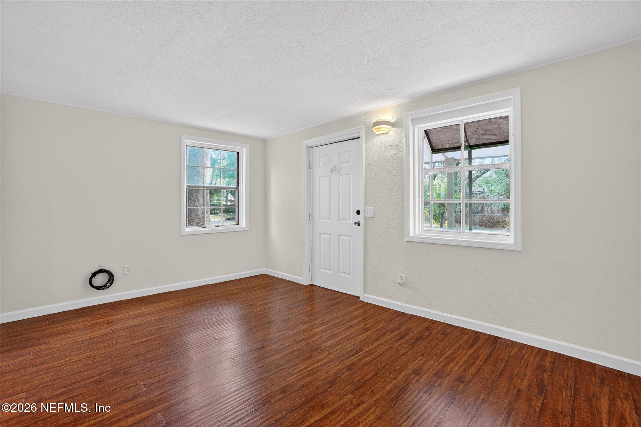 1217 Cook Street Jacksonville, FL 32205 - Photo 2 of 43 an empty room with wooden floor and windows