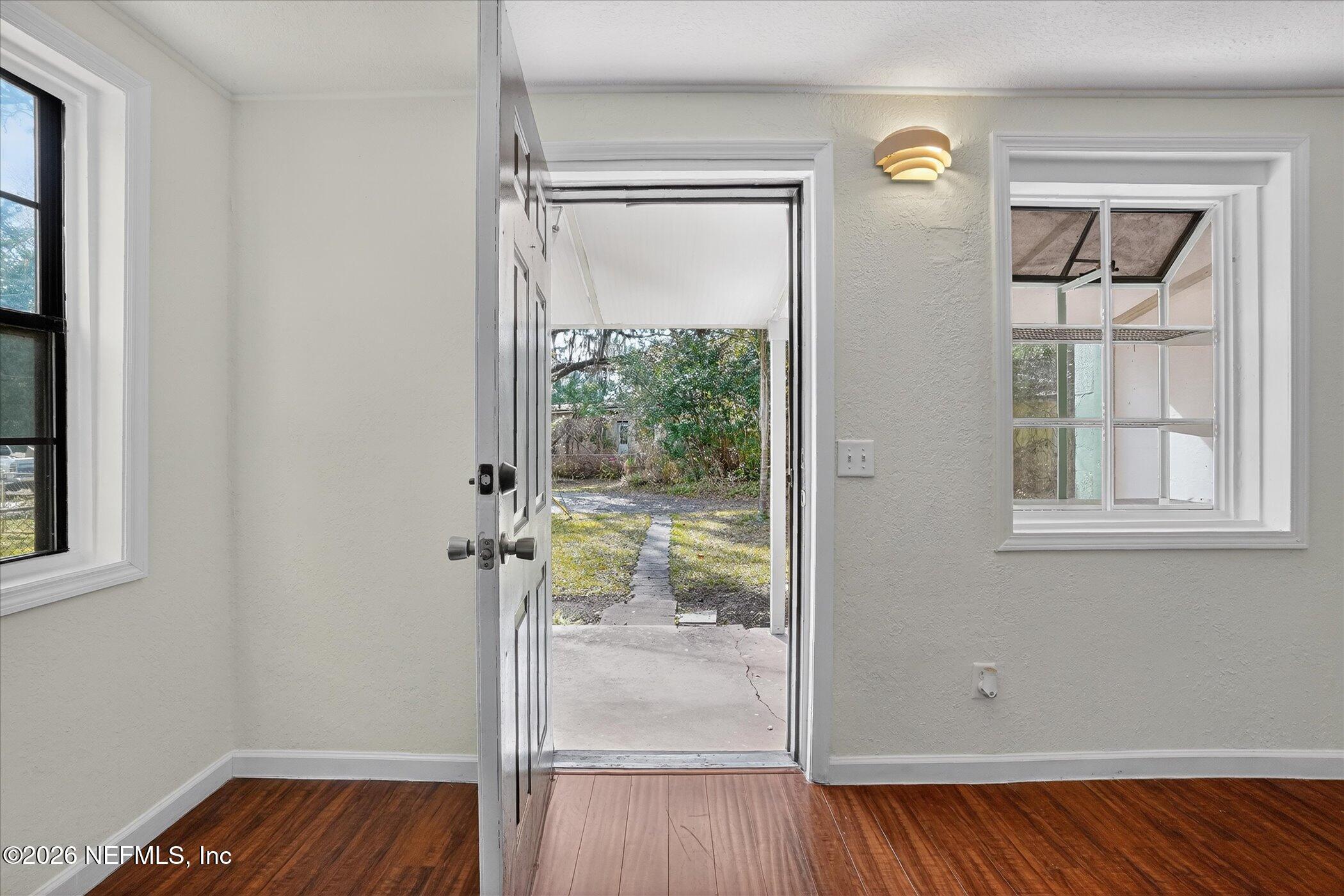 1217 Cook Street Jacksonville, FL 32205 - Photo 22 of 43 an empty room with wooden floor closet and windows