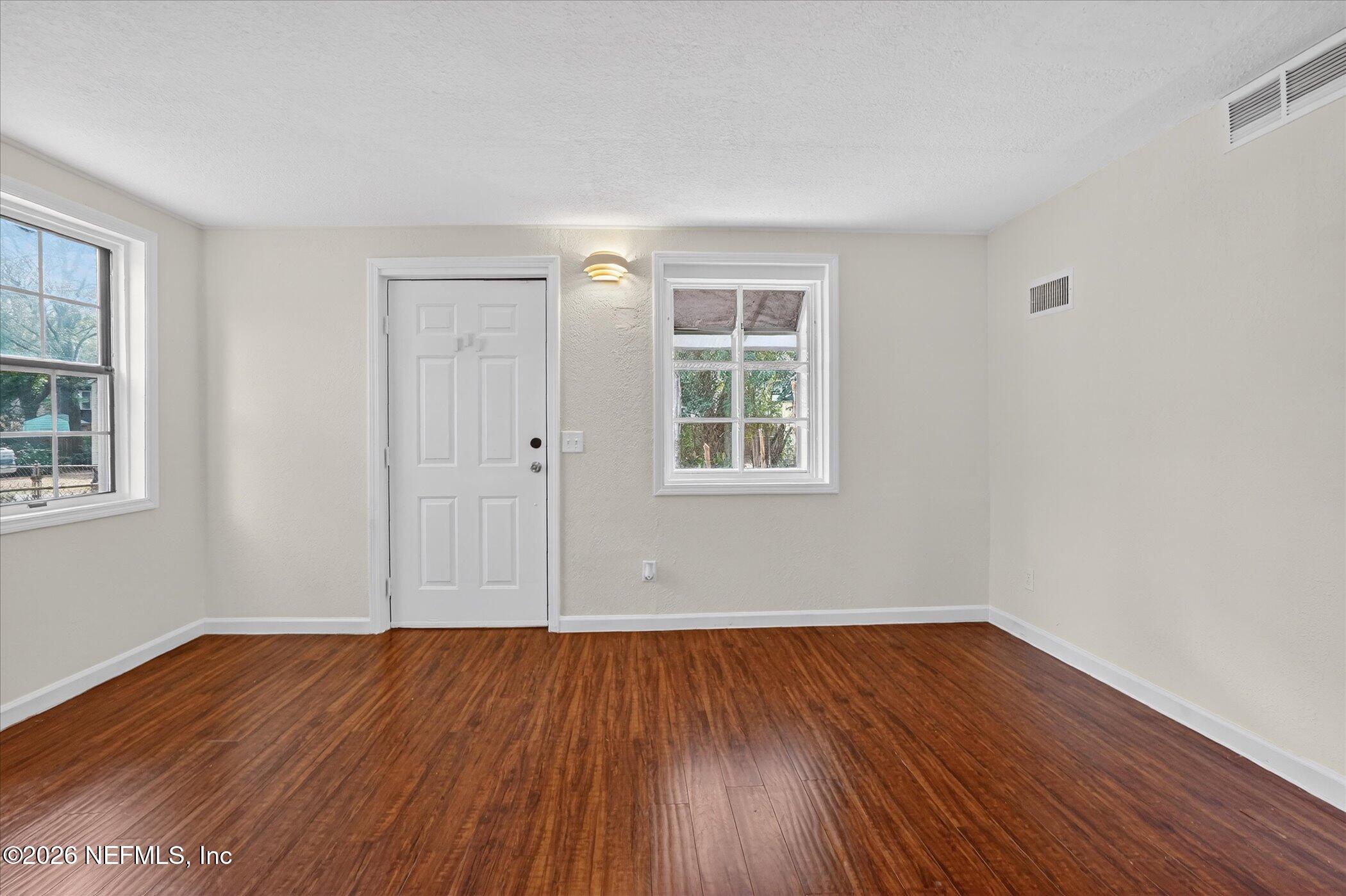 1217 Cook Street Jacksonville, FL 32205 - Photo 23 of 43 a view of a room with wooden floor and windows