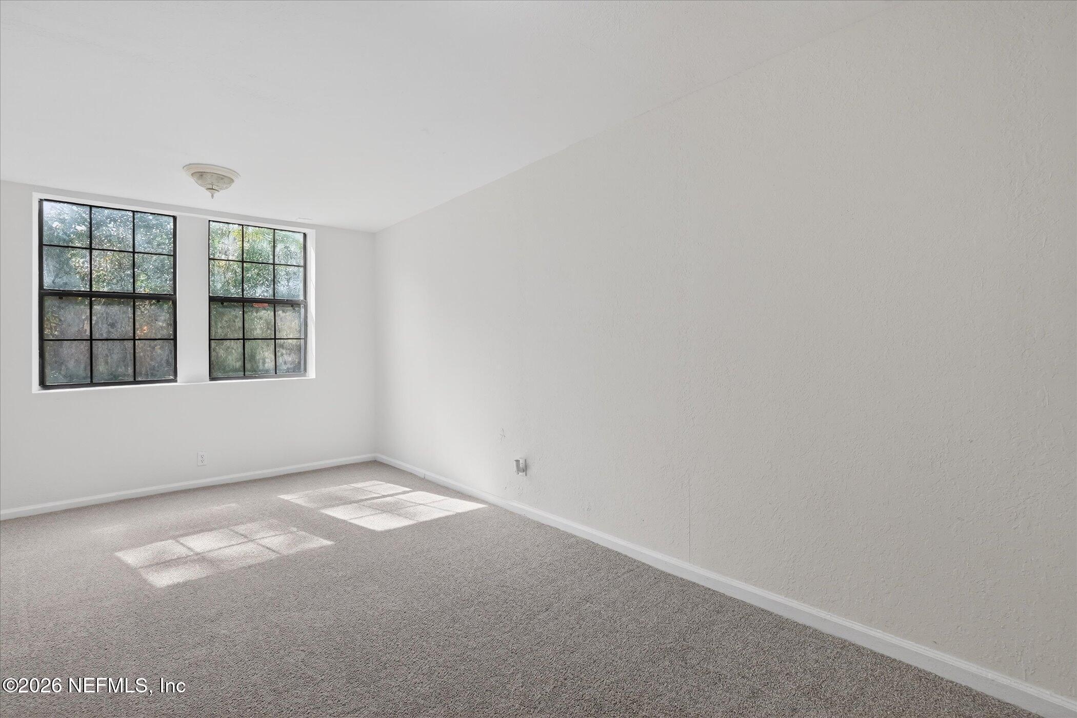 1217 Cook Street Jacksonville, FL 32205 - Photo 28 of 43 a view of an empty room with a window