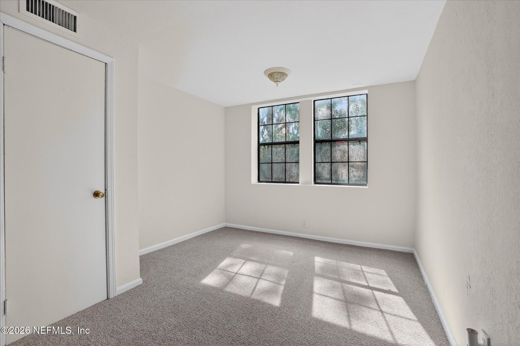 1217 Cook Street Jacksonville, FL 32205 - Photo 8 of 43 a view of an empty room with windows