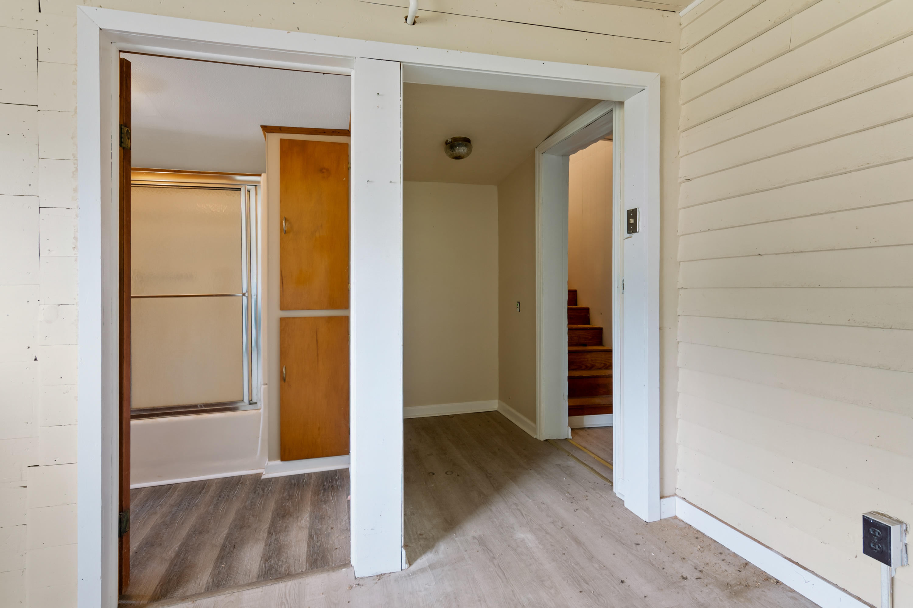 767 Kyle Weeks Road Southwest Willis, VA 24380 - Photo 41 of 86 an empty room with wooden floor and closet