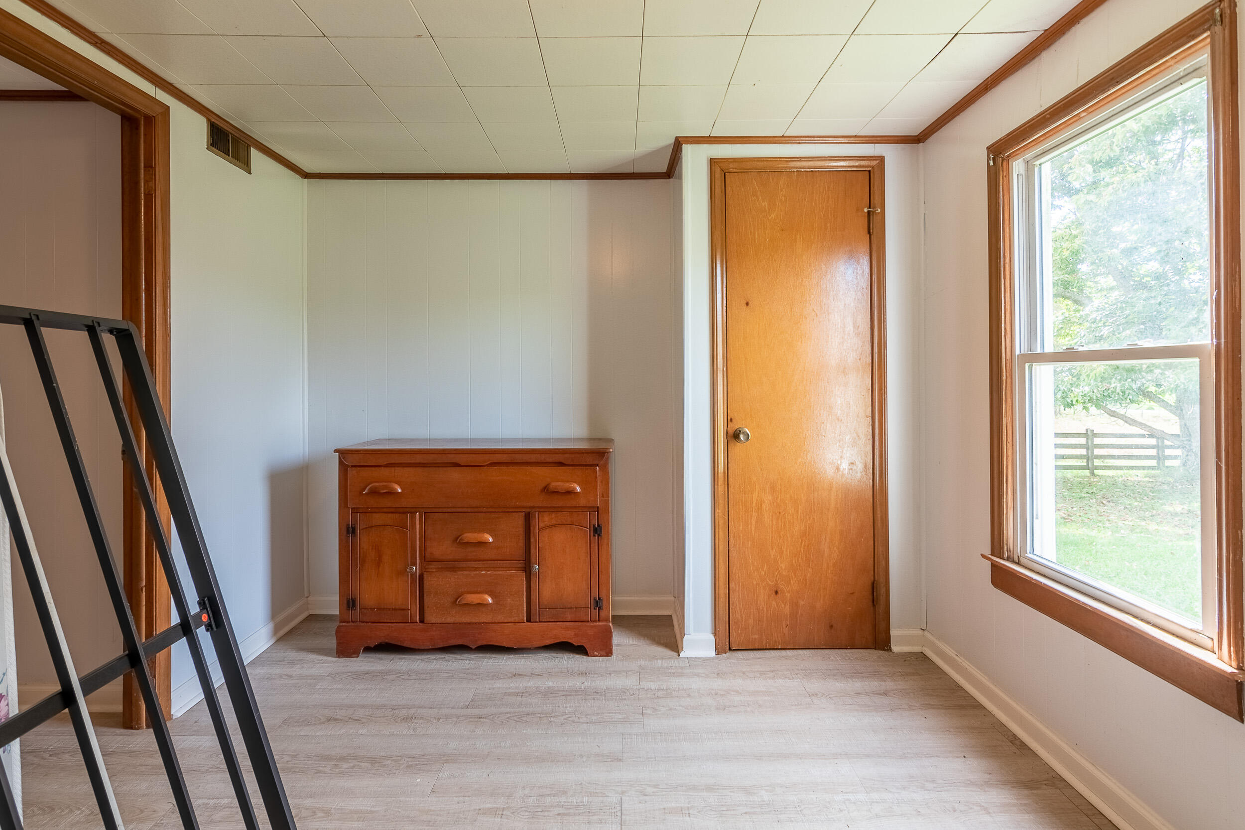 767 Kyle Weeks Road Southwest Willis, VA 24380 - Photo 46 of 86 a view of an empty room with wooden floor and a window