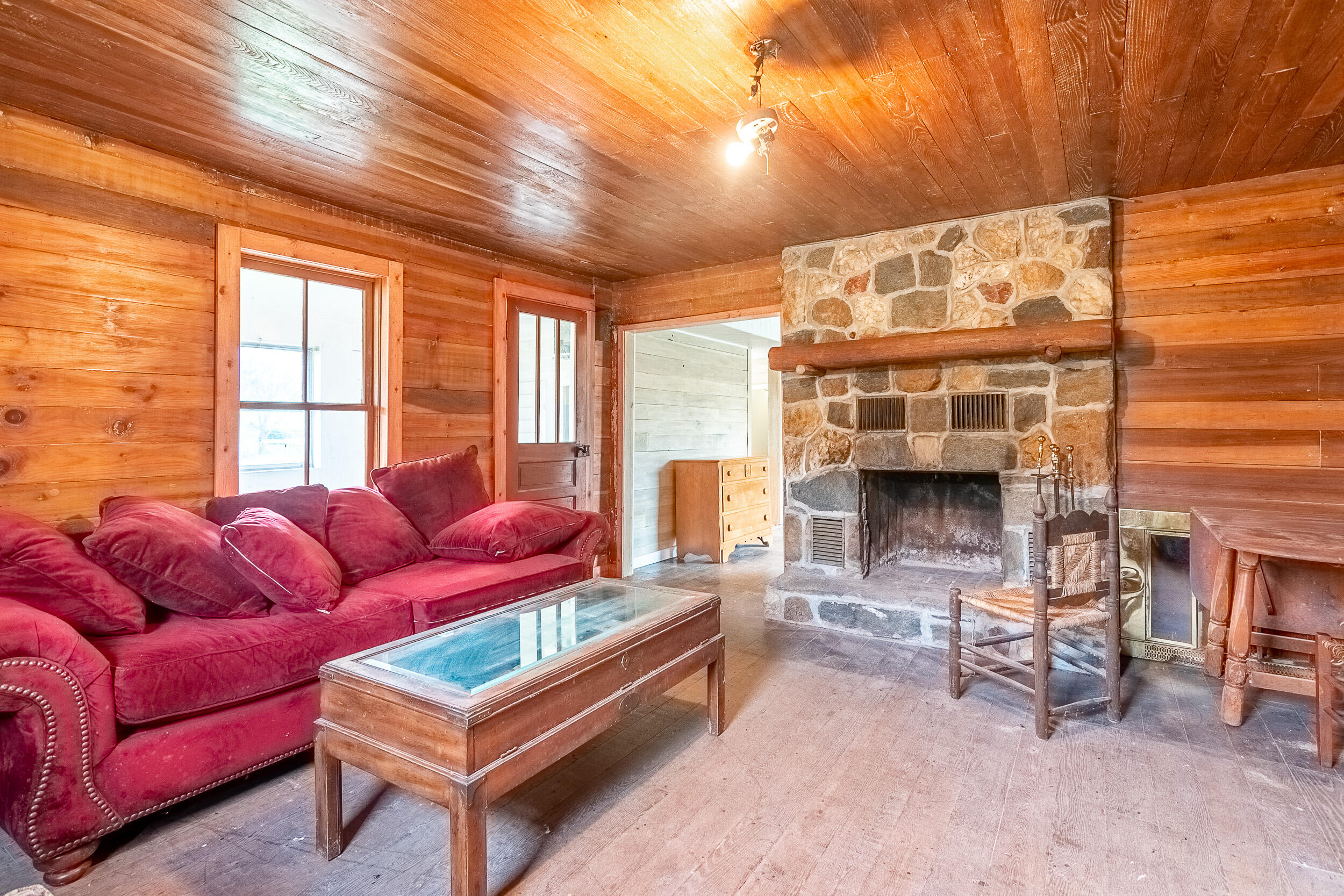 767 Kyle Weeks Road Southwest Willis, VA 24380 - Photo 50 of 86 a living room with furniture a fireplace and a table