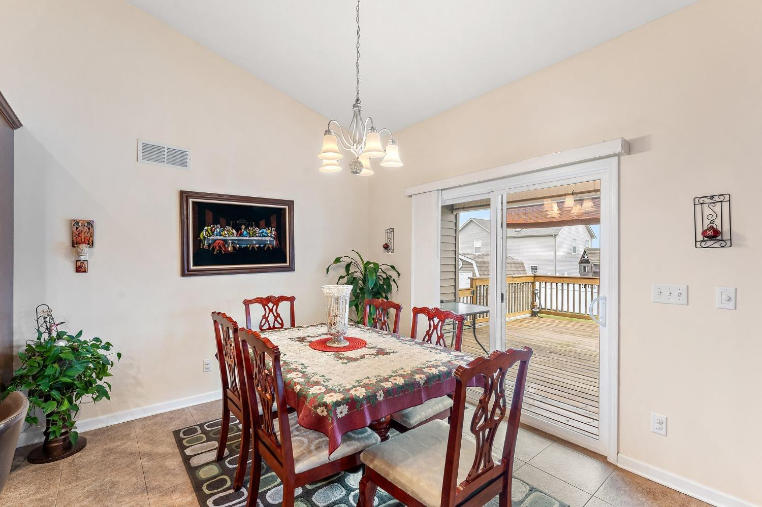 10331 Nelson Street Crown Point, IN 46307 - Photo 20 of 47 a dining room with furniture potted plants and wooden floor