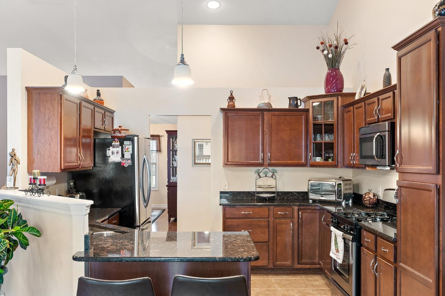 10331 Nelson Street Crown Point, IN 46307 - Photo 24 of 47 a kitchen with stainless steel appliances granite countertop a refrigerator and a stove top oven