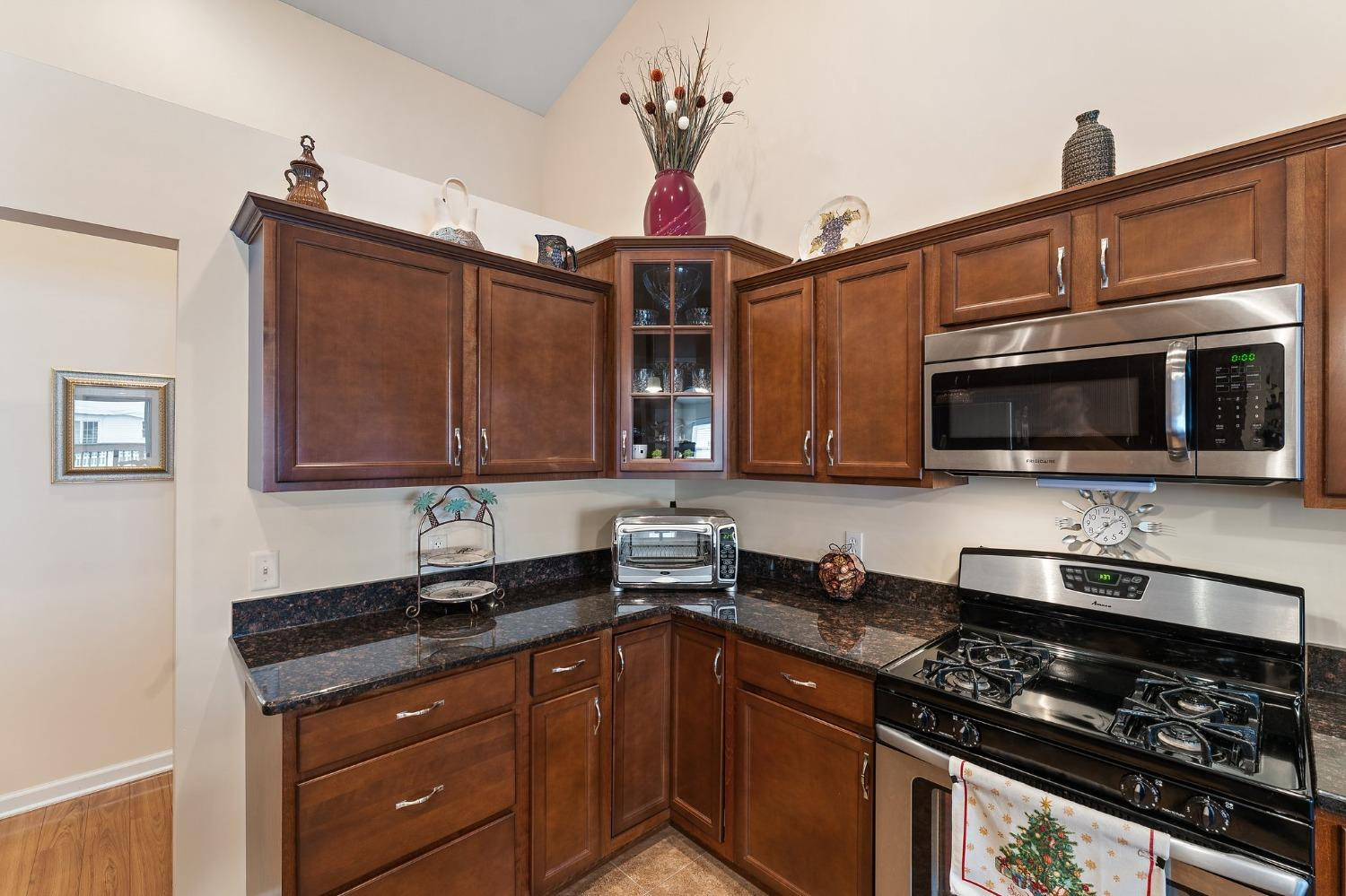 10331 Nelson Street Crown Point, IN 46307 - Photo 26 of 47 a kitchen with stainless steel appliances a sink a stove and cabinets