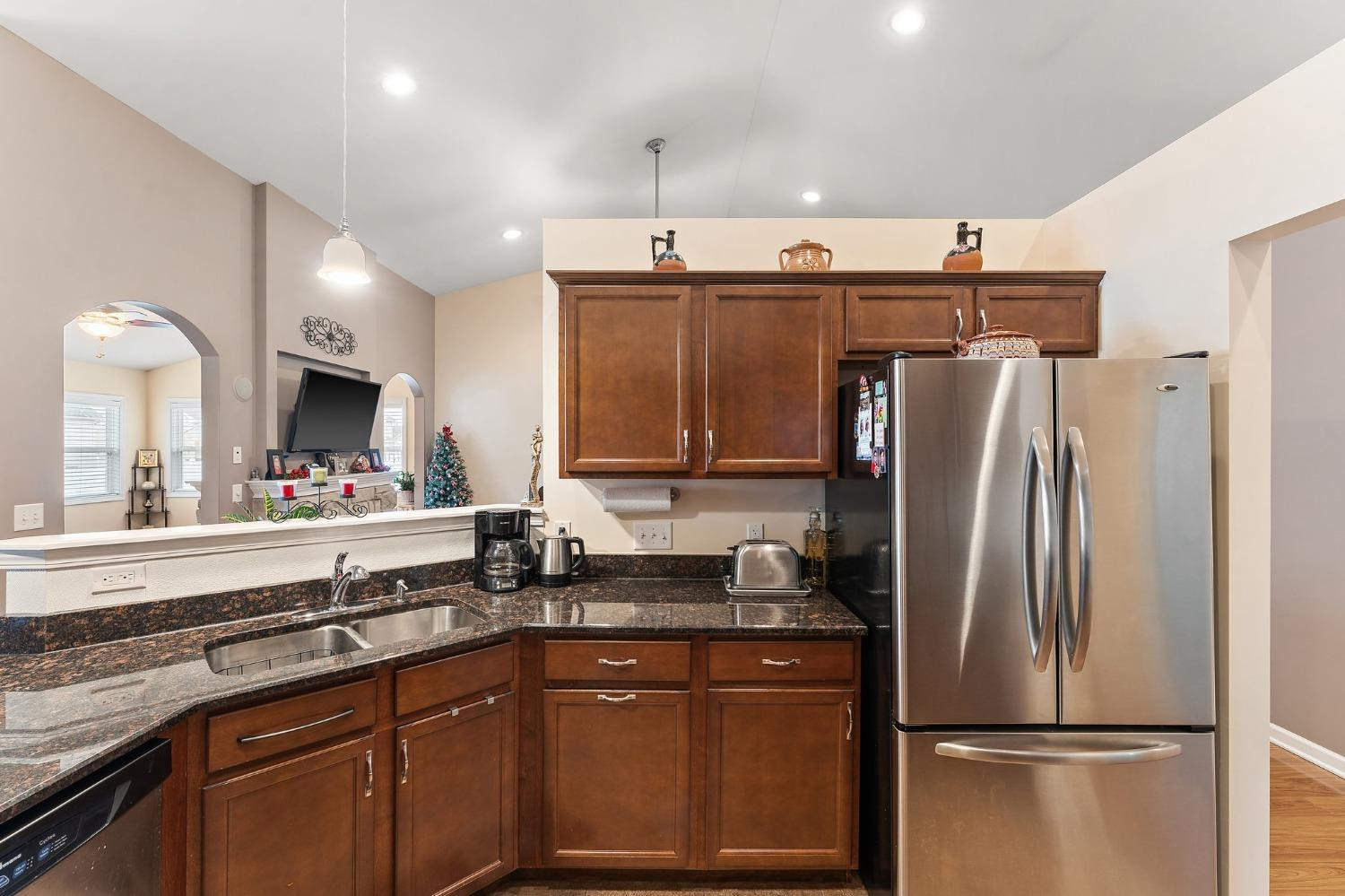 10331 Nelson Street Crown Point, IN 46307 - Photo 27 of 47 a kitchen with stainless steel appliances granite countertop a refrigerator and a sink