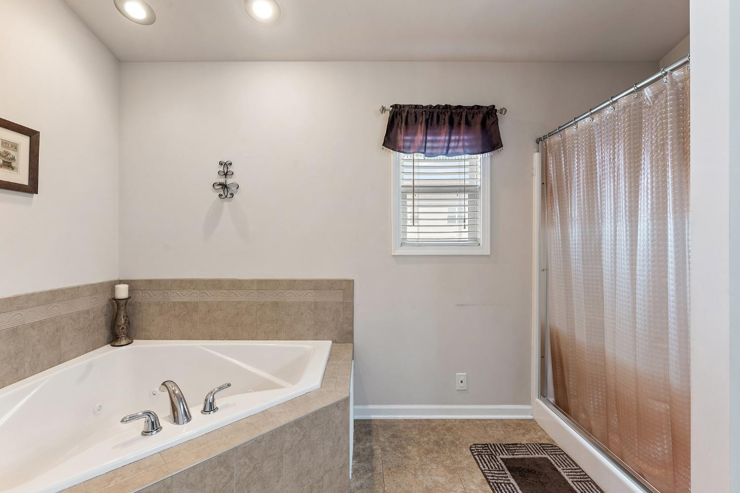 10331 Nelson Street Crown Point, IN 46307 - Photo 33 of 47 a bathroom with a bathtub and shower