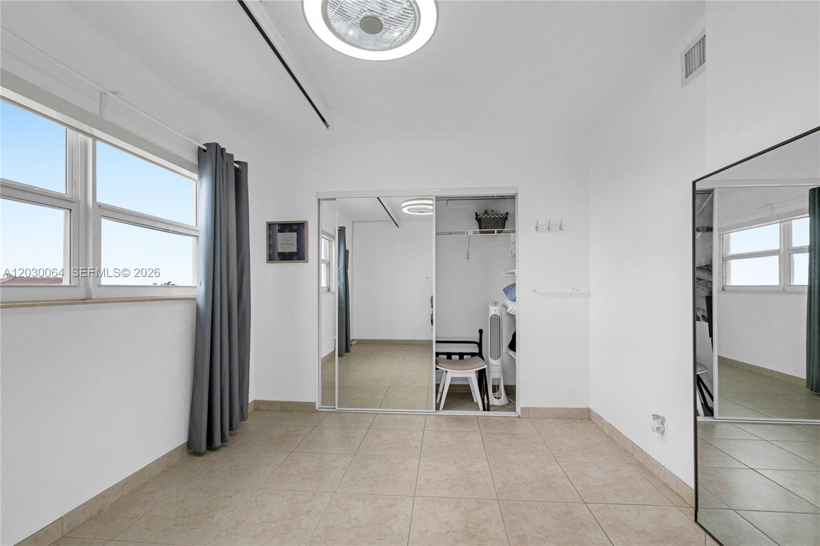 400 North Surf Road, Unit 506 Hollywood, FL 33019 - Photo 24 of 37 Second bedroom, impact windows and views of the beach and intracoastal.