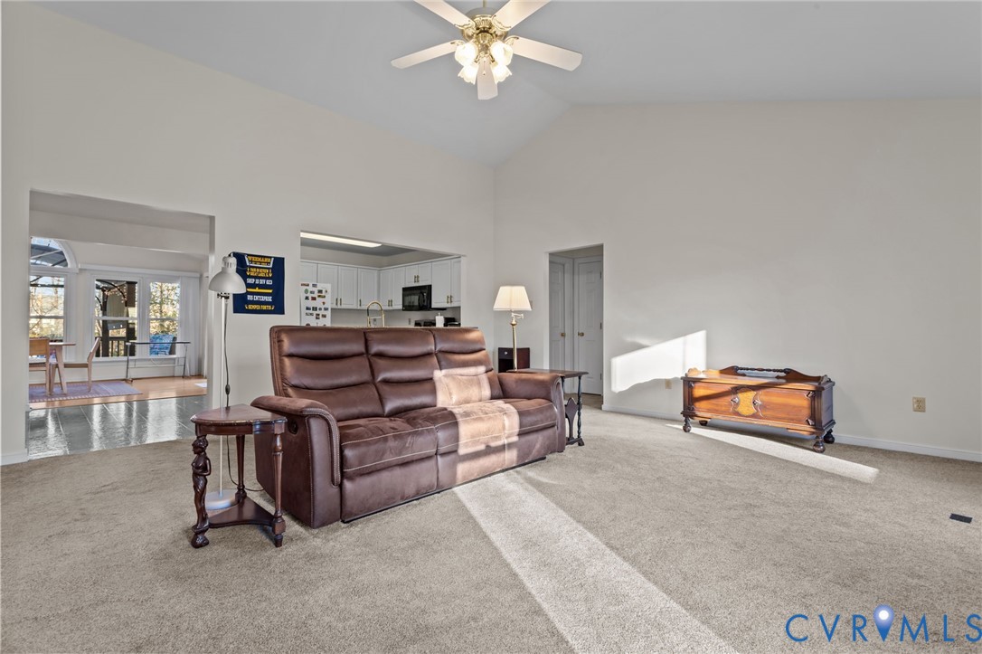 518 Rebel Ridge Road Colonial Heights, VA 23834 - Photo 13 of 44 a living room with furniture and a chandelier