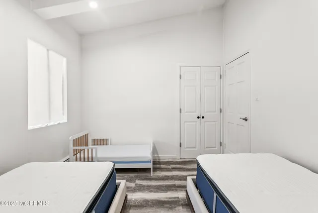 a bedroom with a bed and a table