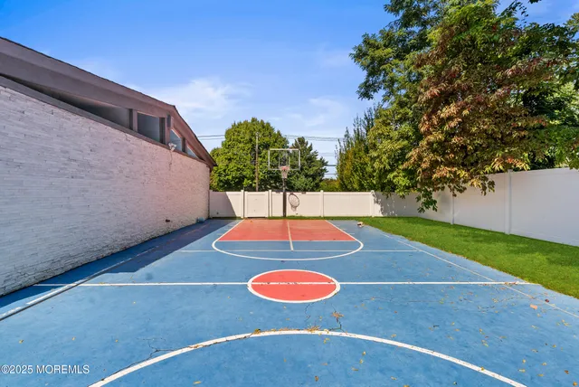 a view of a patio with table and chairs and floor to ceiling window