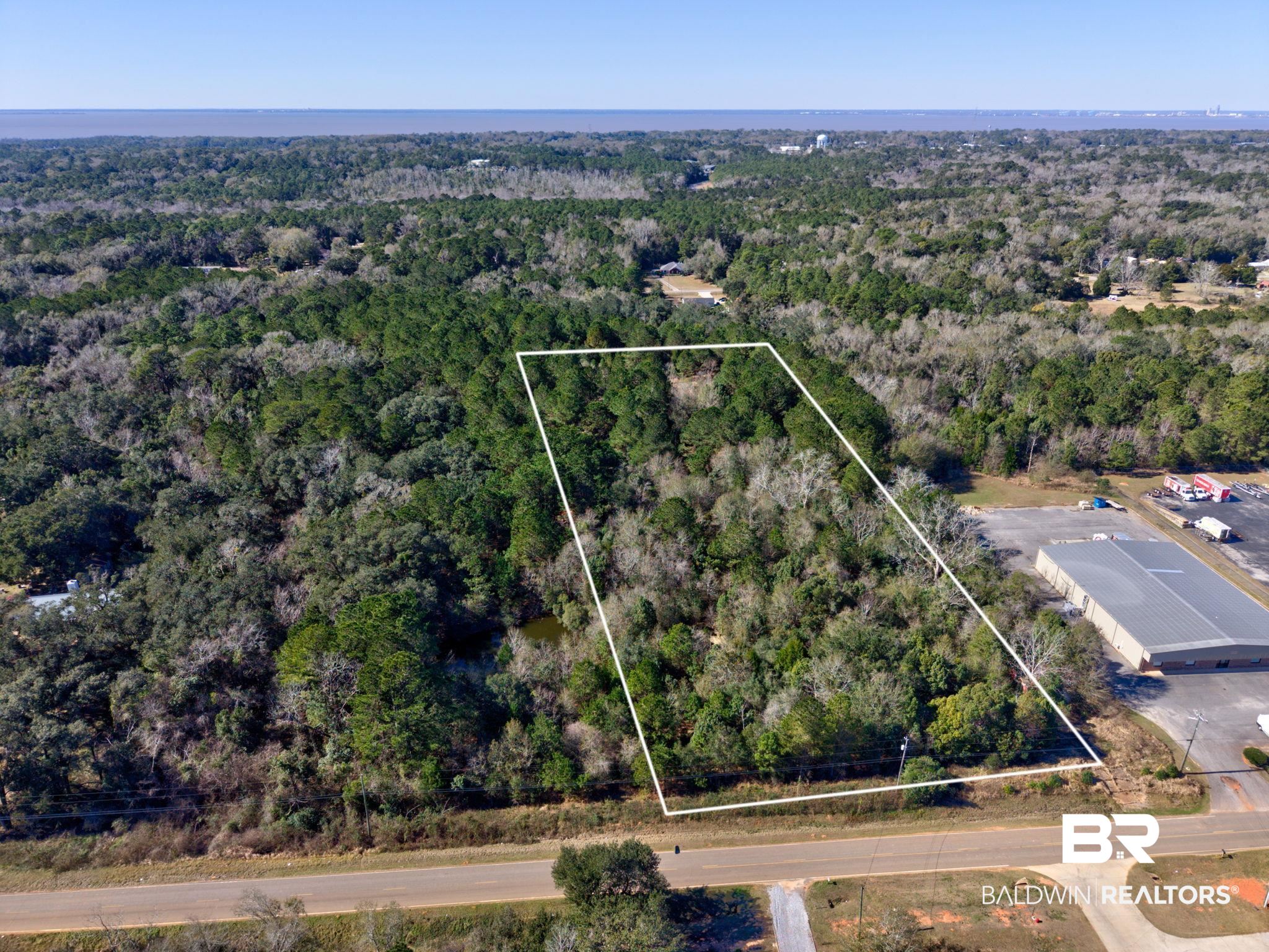 25280 Friendship Road Daphne, AL 36526 - Photo 2 of 34 View of property location with property boundaries highlighted and a heavily wooded area