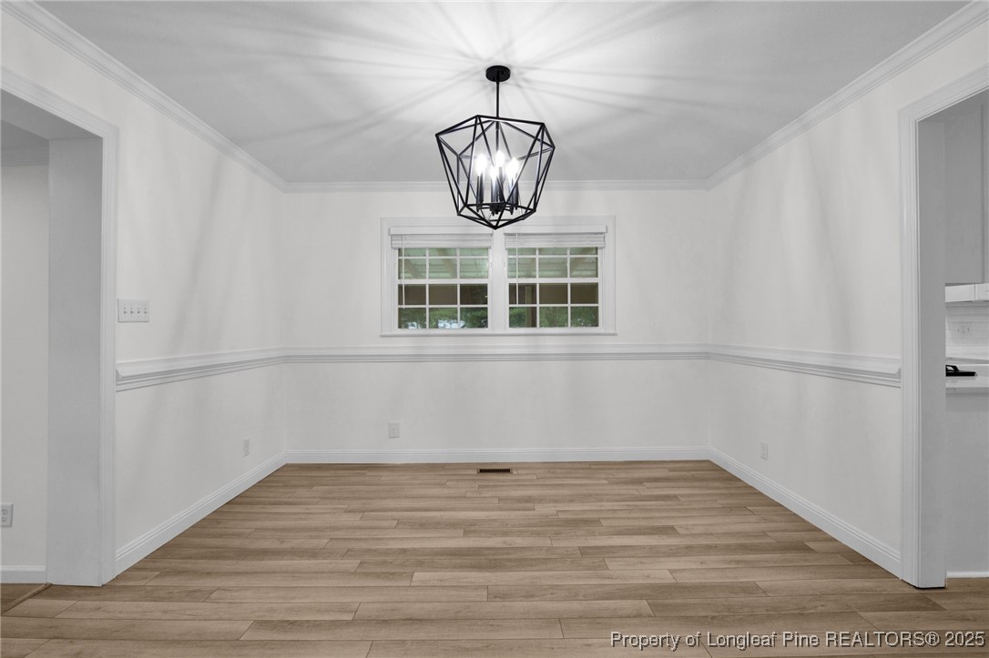 309 Cornith Road Pembroke, NC 28372 - Photo 11 of 40 a view of a room with a chandelier