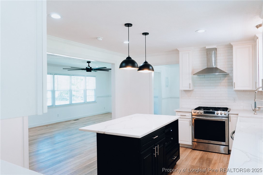 309 Cornith Road Pembroke, NC 28372 - Photo 13 of 40 a kitchen with stainless steel appliances granite countertop a sink a stove a refrigerator and a window