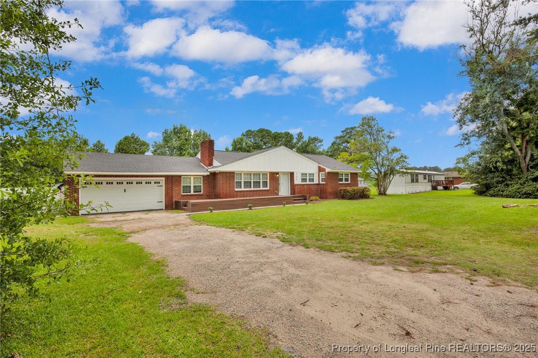 309 Cornith Road Pembroke, NC 28372 - Photo 2 of 40 a view of house with yard and green space