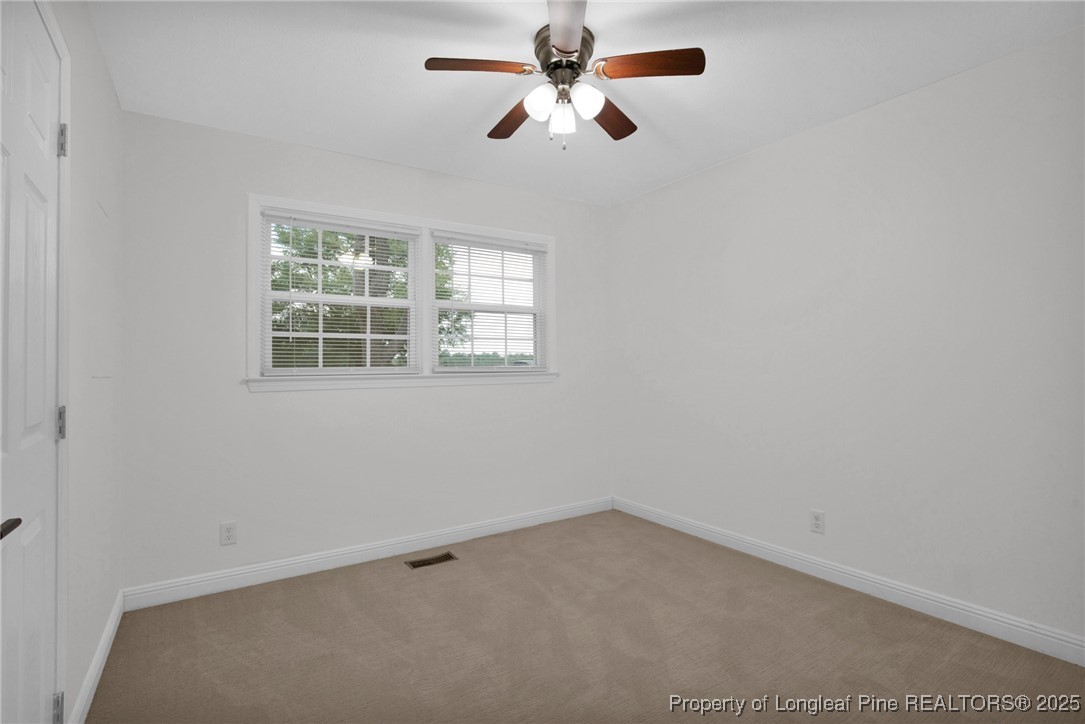 309 Cornith Road Pembroke, NC 28372 - Photo 23 of 40 an empty room with windows and fan