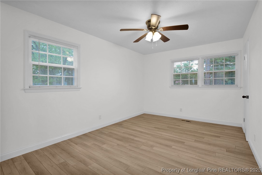 309 Cornith Road Pembroke, NC 28372 - Photo 24 of 40 a view of empty room with wooden floor and fan