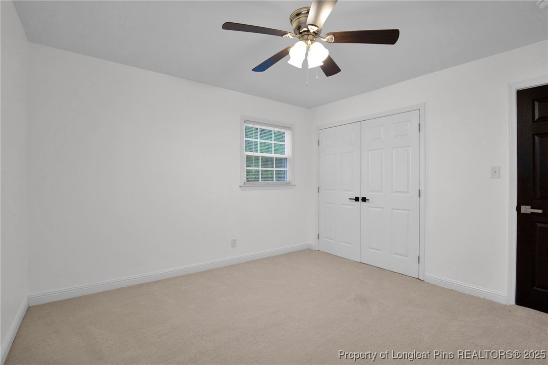 309 Cornith Road Pembroke, NC 28372 - Photo 29 of 40 an empty room with a window and a ceiling fan