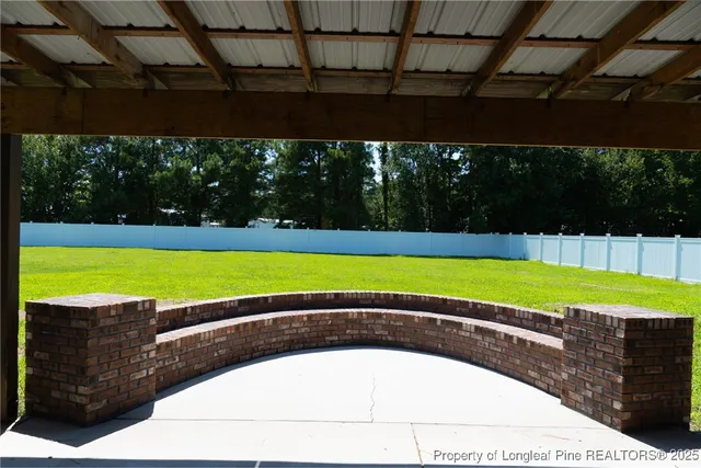 a view of a swimming pool with a yard