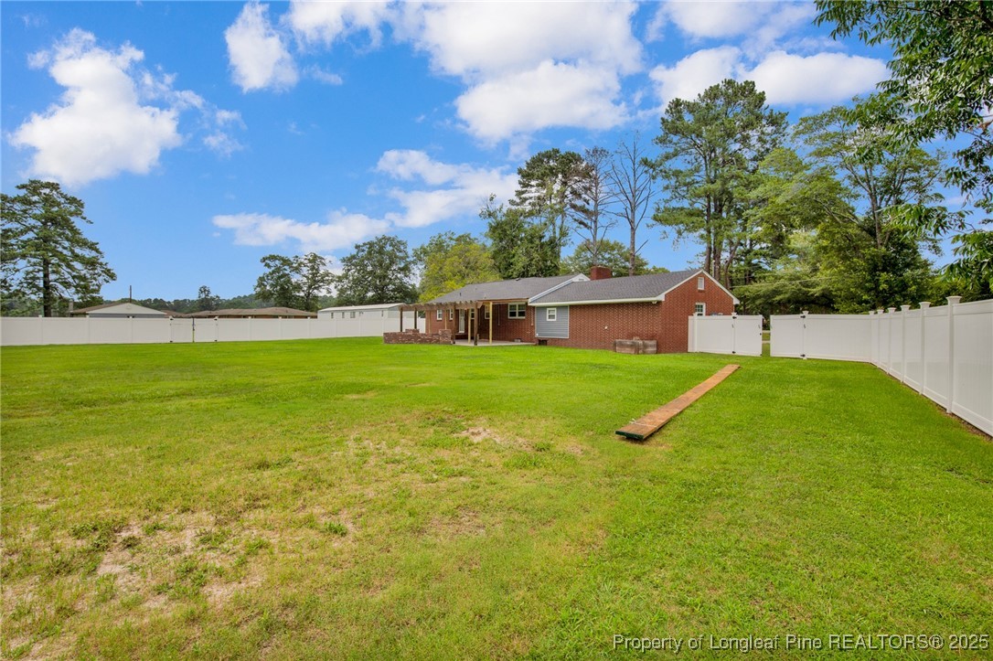309 Cornith Road Pembroke, NC 28372 - Photo 37 of 40 a view of yard with swimming pool and green space