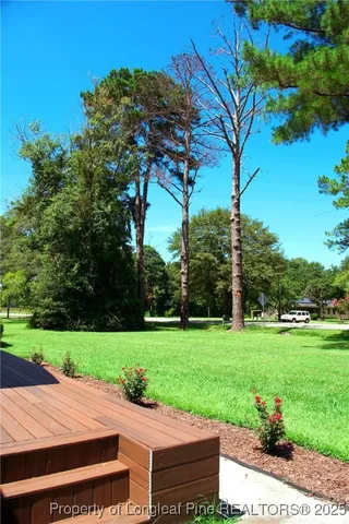 a view of a patio with a yard