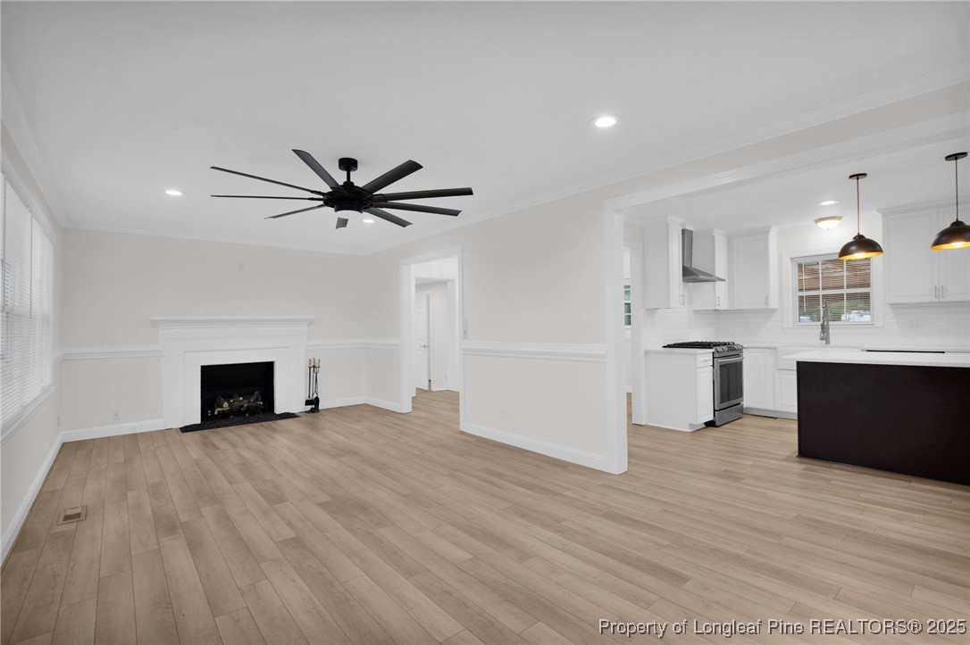 309 Cornith Road Pembroke, NC 28372 - Photo 10 of 40 a view of a kitchen with a sink and a fireplace