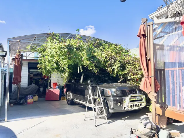 a view of outdoor space with seating area and small garden