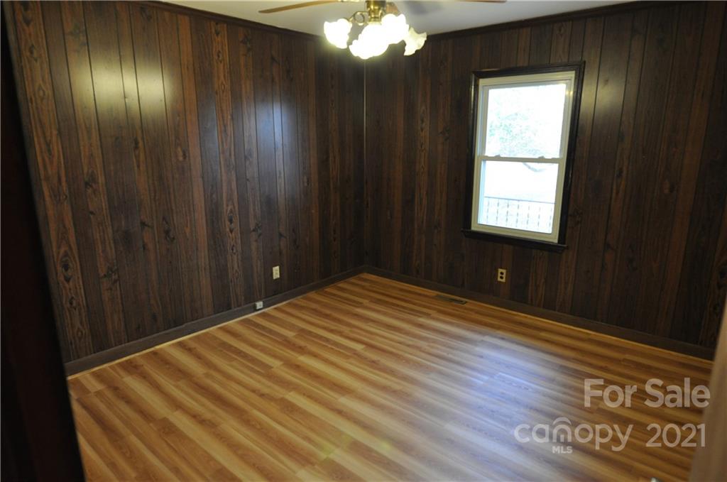 1234 Saluda Road Chester, SC 29706 - Photo 13 of 19 a room with a bed and a chandelier