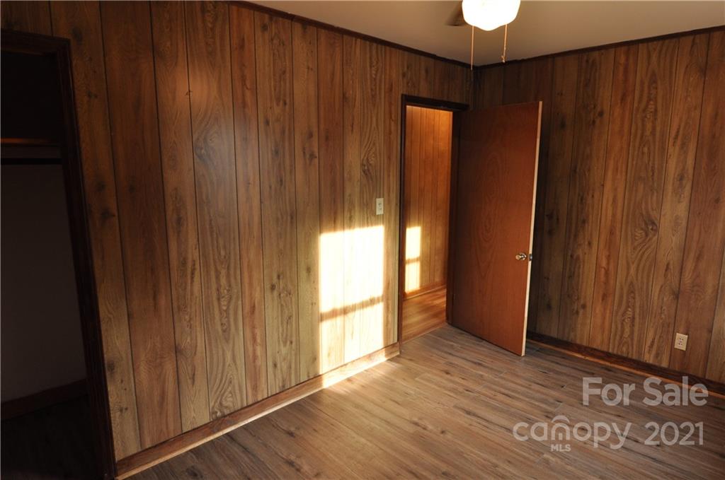 1234 Saluda Road Chester, SC 29706 - Photo 18 of 19 a view of an empty room with wooden floor and a window