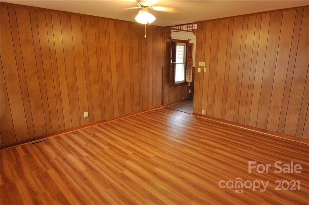 1234 Saluda Road Chester, SC 29706 - Photo 8 of 19 an empty room with wooden floor and windows