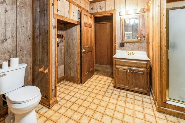 a bathroom with a sink toilet and mirror