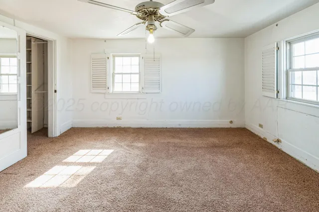 a view of a hallway view with wooden floor and staircase