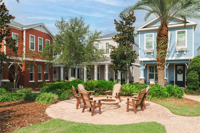a view of a house with backyard sitting area and garden