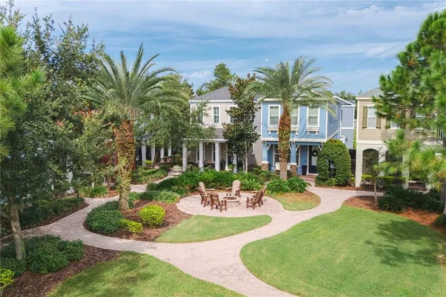 a front view of a house with a garden and patio